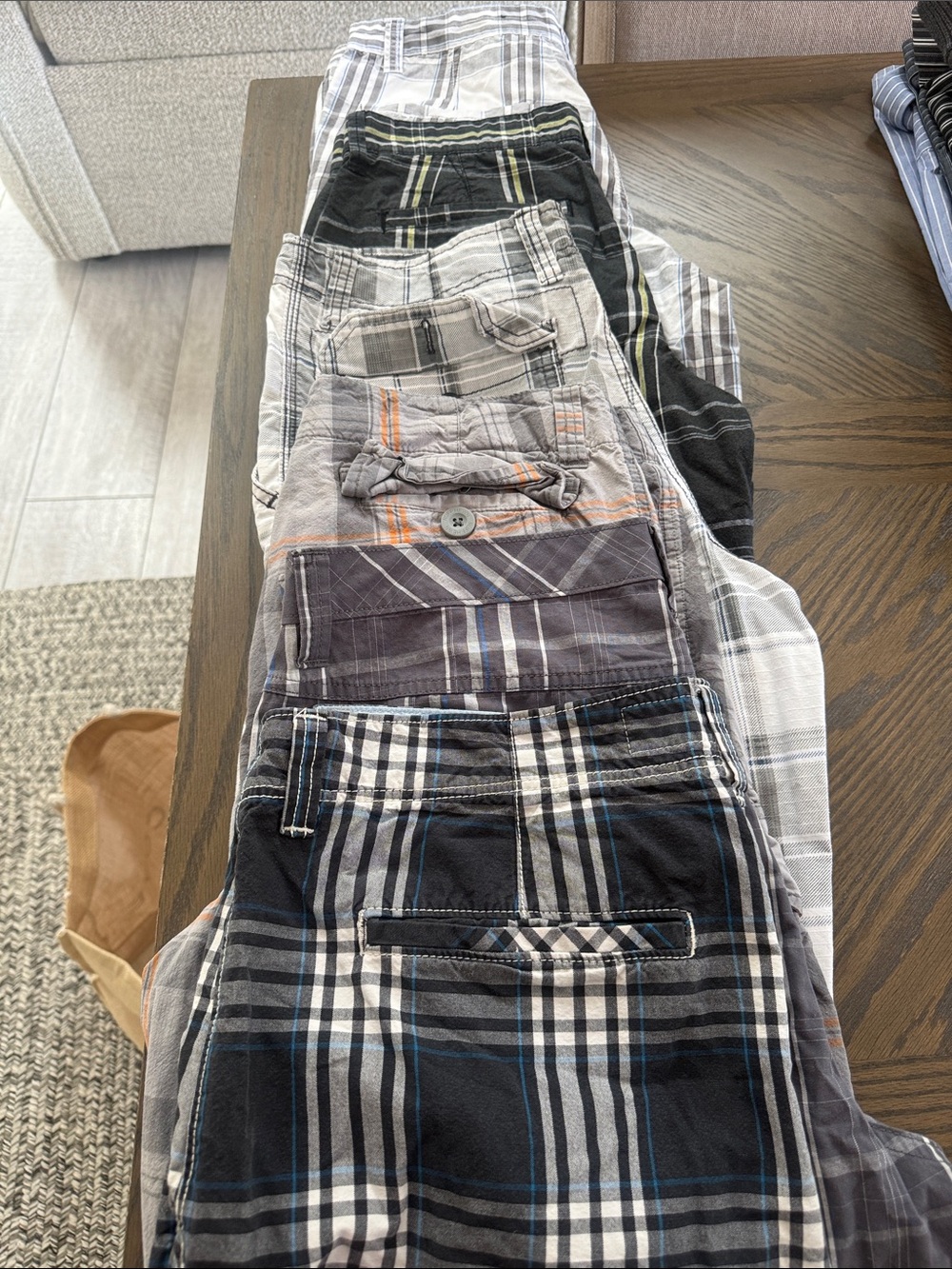 Men's Black Plaid Cargo Shorts 1 is size 31 (American Eagle) and the rest 32